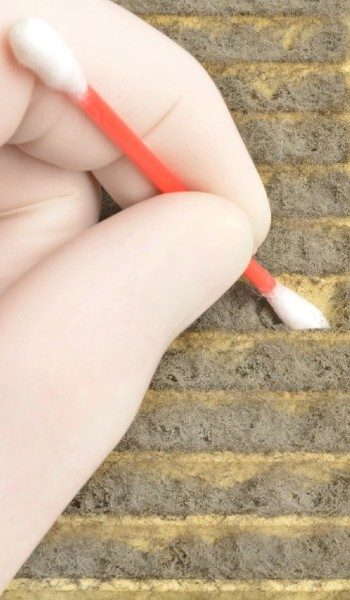 Air Quality Service Thumbnail - The Qualified Specialist Cleaning the Wall with a Cottonbud